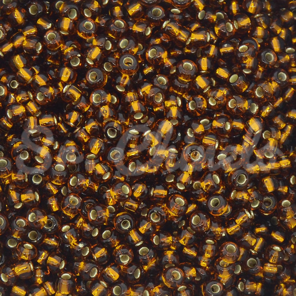 Miçangão Jablonex, 5/0, Ouro Velho Transparente